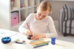 Ascuțitoare plastic triplă cu container grip 2001 roșie/albastră Faber-Castell